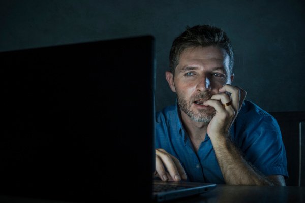 Man watching porn on laptop computer. 
