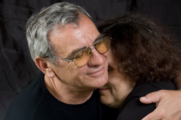 Kind husband hugging his wife.