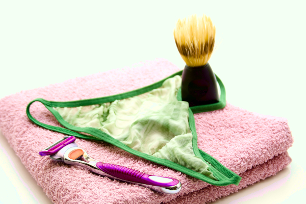 Towel, razor, shaving brush, and a pair of panties